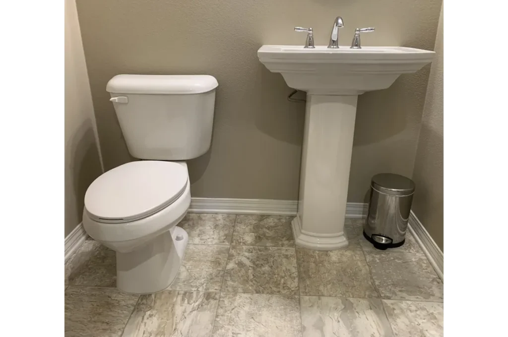 Toilet Repair and Replacement in Menifee by licensed plumber installing new residential toilet